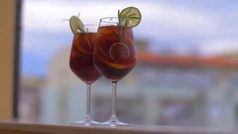 Time for a break. Refreshing Cocktail Sangria with Fruits and Ice Stock Footage 110025546