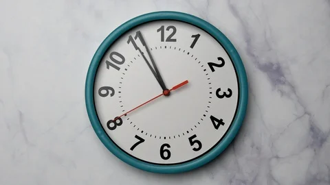 The Time On The Clock Eleven. Turquoise Clock With The Red Arrow With The Arabic 스톡 동영상 128742882