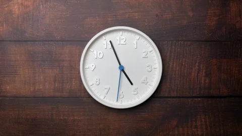 The Time On The Clock Five. White Clock With The Blue Arrow With The Arabic Nume Vídeo Stock 128741755