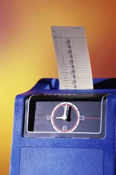 Time clock machine with a punch card Stock Photos