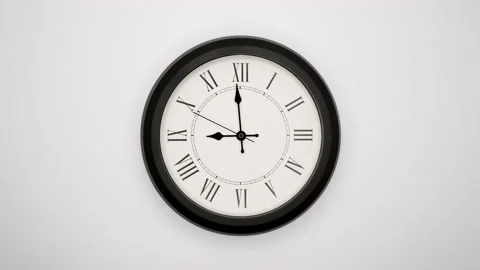 The Time On The Clock Nine. White Wall Clock With Black Rim And Black Hands. 4k, Stock Footage 219702984