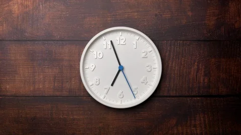 The Time On The Clock Seven. White Clock With The Blue Arrow With The Arabic Num 스톡 동영상 128742029