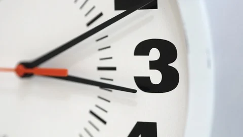 The Time On The Clock Three. Clock With The Red Arrow Running 動画素材 105598577