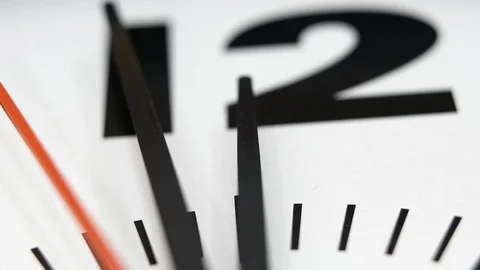 The Time On The Clock Twelve. Clock With The Red Arrow Running In The Background Vídeos de archivo 106550726