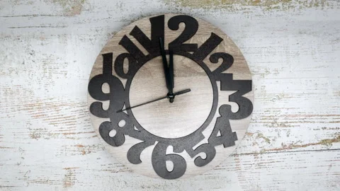 The Time On The Clock Twelve. Wooden Clock With The Black Arrow And The Arabic N Stock Footage 168368158