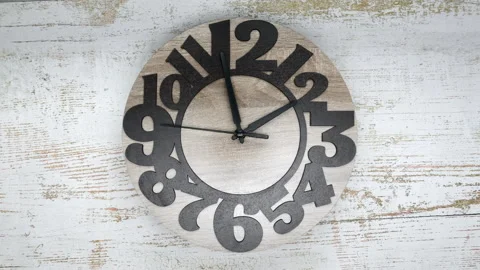 The Time On The Clock Two. Wooden Clock With The Black Arrow And The Arabic Nume Stock Footage 168369633