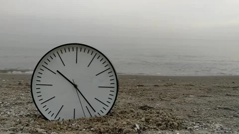 Time Concept Background, White Wall Clock on Sand Beach Foggy Sea Sky Stock Footage 86394077