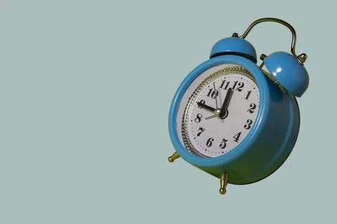 Time concept. Blue alarm clock on a light blue background. 스톡 일러스트