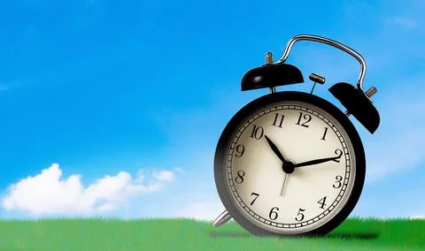 Time Concept on Blue Sky Background Stock Photos