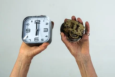 Time concept, clock, alarm clock, watch mechanism, old and new watches. Stock Photos