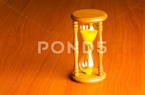 Time concept with hourglass against background Stock Photos