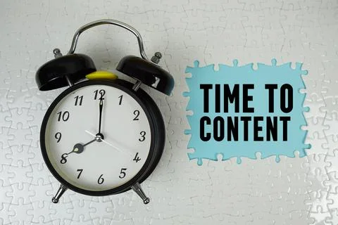 Time To Content text with alarm clock on blue background Stock Photos