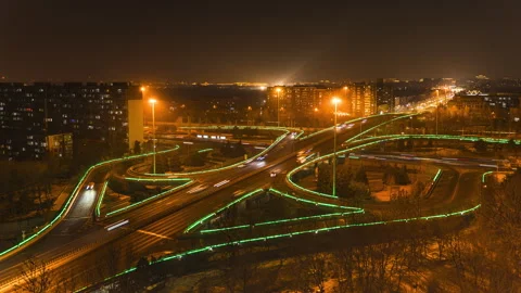 Time delay of traffic flow at overpass intersection at night Stock Footage 270659463