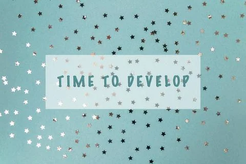 Time to develop message with clock and confetti on light blue background 스톡 사진