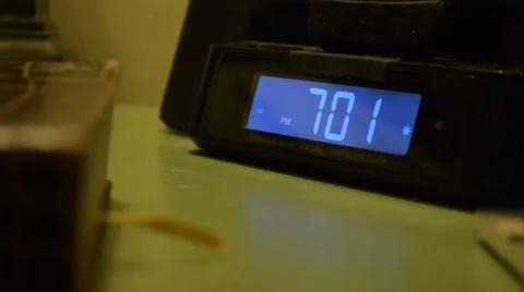 Time on digital clock reads 7:01PM Video stock 67366434