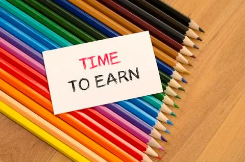 Time to earn text concept over pencil background Foto stock
