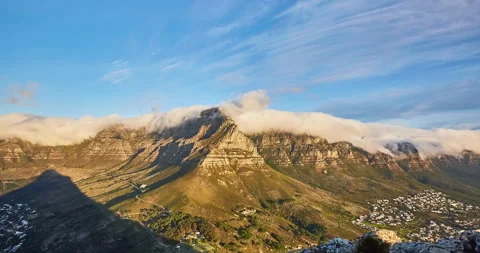 Time elapse of rolling clouds over mountain at sunset,Cape Town,South Africa Stock Footage 140584699