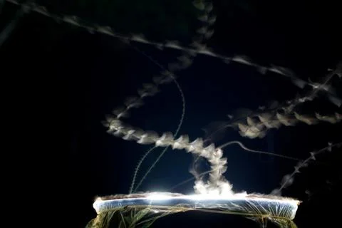 Time Exposure - Showing Flight Path of Moths Attracted to Light Stock Photos