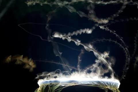Time Exposure - Showing Flight Path of Moths Attracted to Light Stock Photos