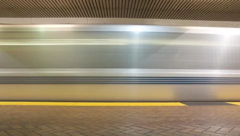A time exposure of a train in an underground station Stock Photos