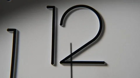 Time flows as clock face dims with fading light Stock Footage 296214917