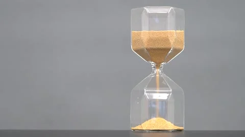 Time goes by on the hourglass Stock Footage 145584656