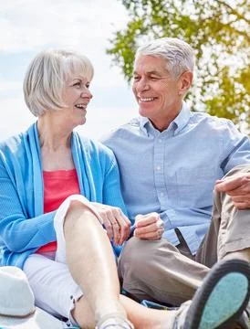 Time hasnt changed their bond one bit. a happy senior couple relaxing together Stock Photos