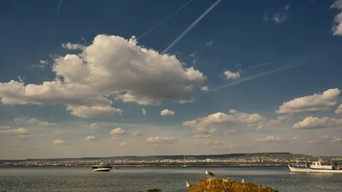Time interval. 4k. White clouds over the sea. Stock Footage 116859716