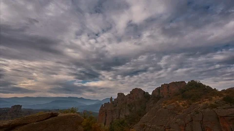Time interval. view red rocks in the forest, white clouds move across the sky. Stock Footage 116917750