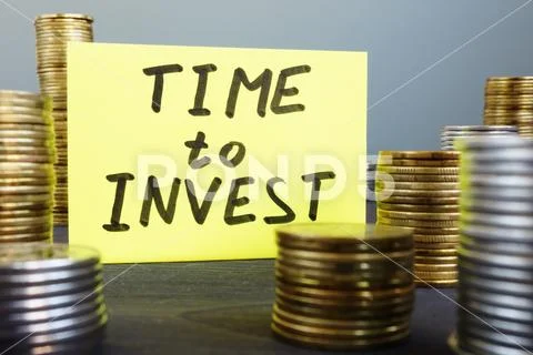 Time to invest. Money and memo stick. Stock Photos