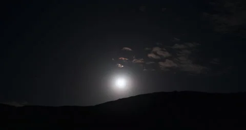 Time lapce night clouds and full moon rises over top of mountain. 4k UHD Stock Footage 146451953