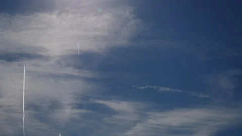Time lapes of clouds with contrails Stock Footage 131874156
