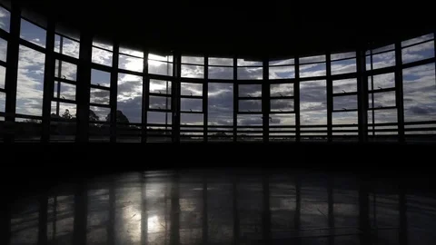 Time lapes inside abandoned building with moving shadows, clouds and sunset Video stock 81464984