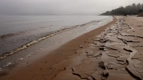 Time laps with beautiful waves creeping onto a sandy beach amid fog. Stock Footage 124269456