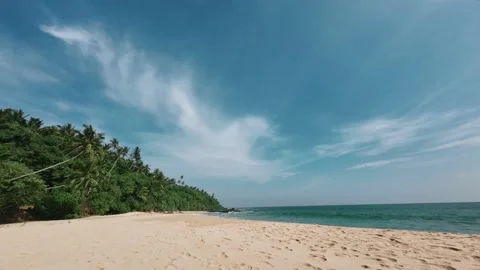 Time laps of the blue sky, white sand and ocean Stock Footage 172500377