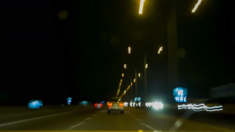 Time laps of blur colorful traffic night lighting movement of car driving on  Stock Footage 133084738