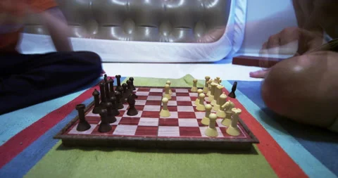 Time laps chess game between father and son Stock Footage 137964771