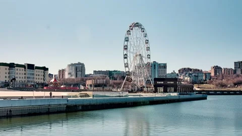 Time laps Clear daytime sky modern city and a spinning Stock Footage 186927134