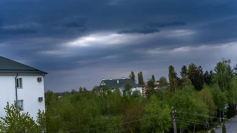 Time Laps. Clouds over the houses Stock Footage 129517362