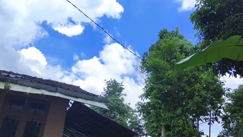 Time laps the clouds in the village that have started to rain Stock Footage 220860293