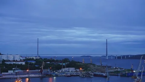 Time laps of the evening city with a view of the Russian bridge. Stock Footage 137653200
