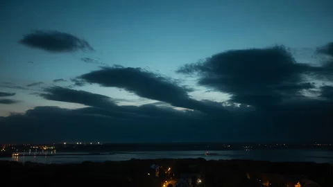 Time-laps of evening sky, turning into night, over river. Lights of night city. Stock Footage 160546654