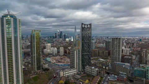 Time laps of  iconic Strata apartment tower with other high rise Stock-Footage 171931112