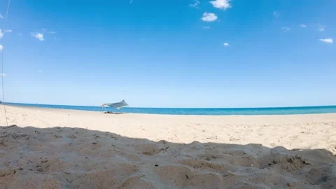 Time laps of sunny sand beach at the middle of the day Stock Footage 135511689