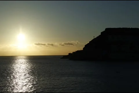 Time laps of Sunset Clear Sky to Golden Over Ocean and Coastline Stock Footage 309951054