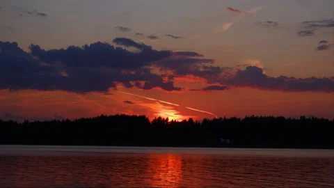 Time laps. Sunset in the clouds on the river in summer. Stock Footage 157835248