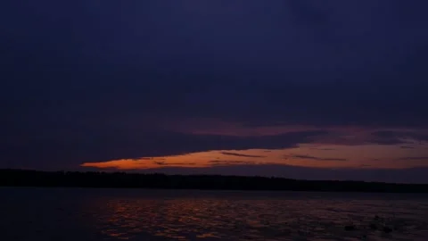 Time laps. Sunset in the clouds on the river in summer Stock Footage 157965355