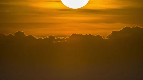 Time laps of sunset moving behind cloudy at end of the day Stock Footage 133014186