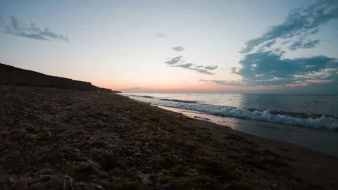 Time laps of sunset over sand beach Stock Footage 136051993