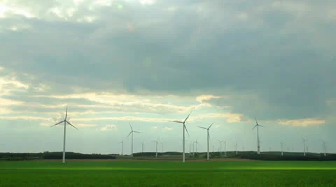 Time laps with wind generators and highway and white clouds Stock Footage